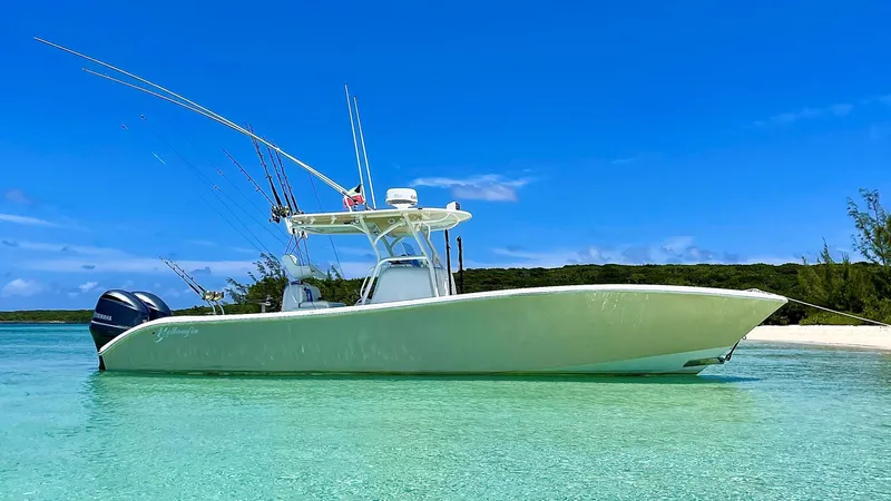 Done Deal Yacht Photos Pics 2015 Yellowfin 32 Offshore boat anchored in clear waters.