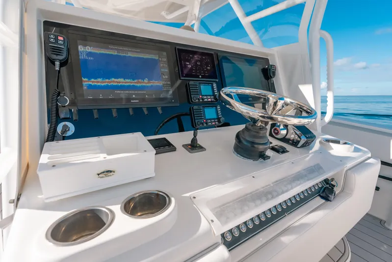  Yacht Photos Pics Control panel of a 2016 Invincible 42 Open Fisherman boat with navigation equipment.