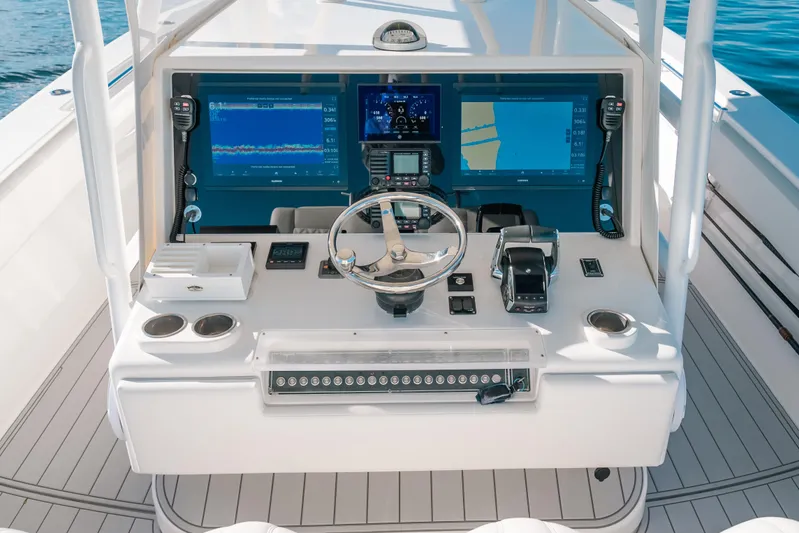 Yacht Photos Pics Control panel of 2016 Invincible 42 Open Fisherman boat with navigation screens.