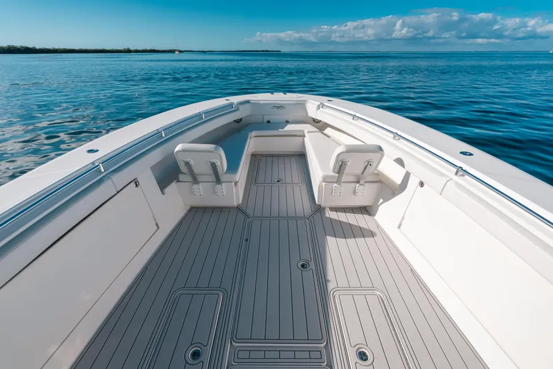  Yacht Photos Pics 2016 Invincible 42 Open Fisherman boat on calm ocean waters.