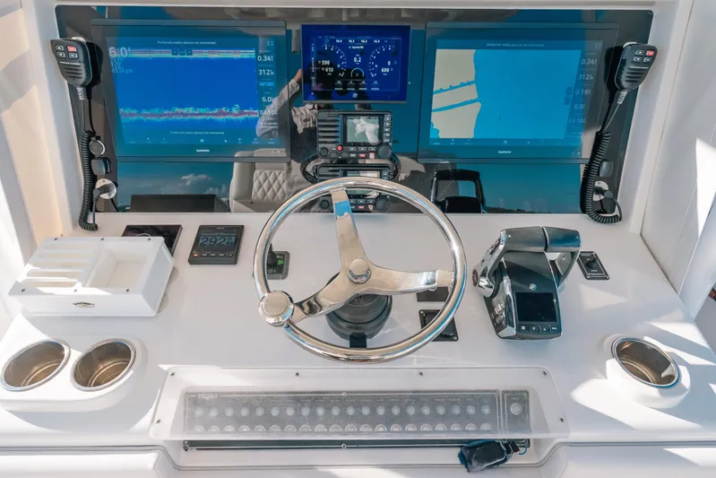  Yacht Photos Pics Helm of 2016 Invincible 42 Open Fisherman with advanced navigation displays and controls.