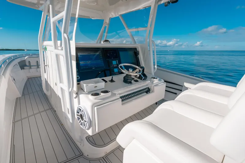  Yacht Photos Pics 2016 Invincible 42 Open Fisherman boat interior with modern controls and ocean view.