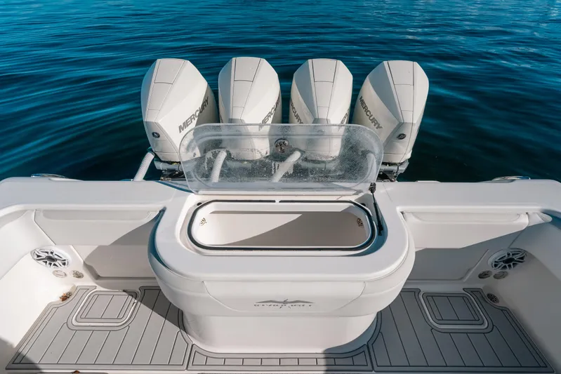  Yacht Photos Pics 2016 Invincible 42 Open Fisherman boat with four Mercury engines on calm water.