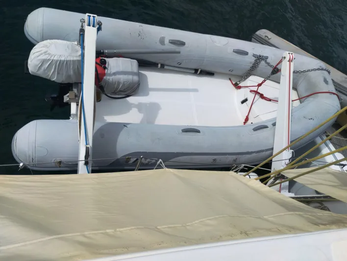  Yacht Photos Pics Inflatable dinghy on Lagoon 570 catamaran, 2004 model, secured on deck.