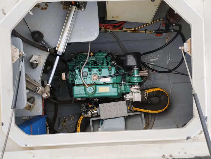  Yacht Photos Pics Engine compartment of a 2004 Lagoon 570 yacht, featuring a green marine engine.