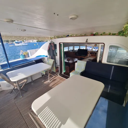  Yacht Photos Pics Spacious deck of 2004 Lagoon 570 yacht with seating and ocean view.