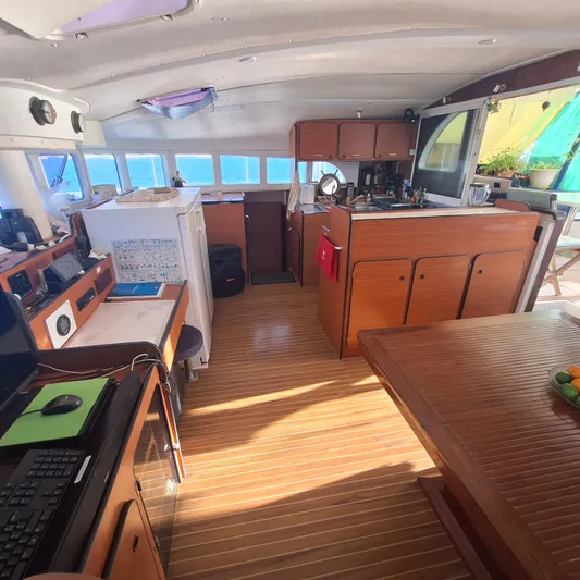  Yacht Photos Pics Interior of 2004 Lagoon 570 yacht with wooden flooring and modern amenities.