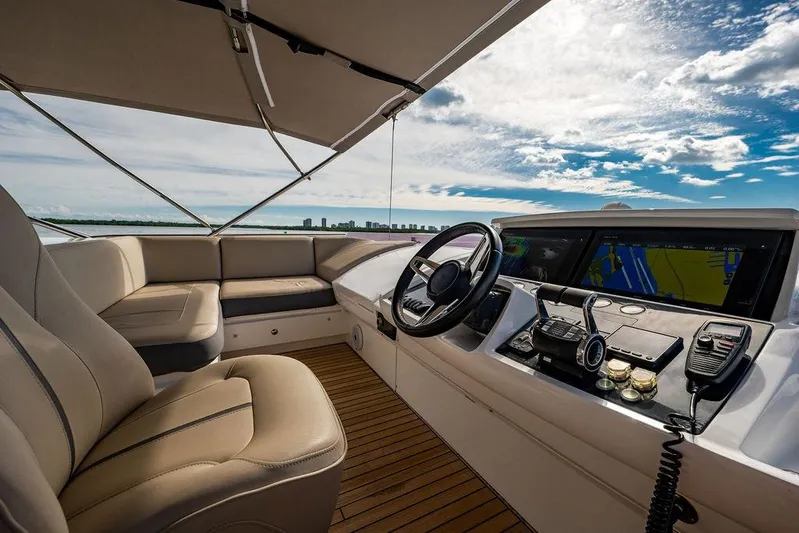  Yacht Photos Pics Luxurious 2016 Princess S65 yacht cockpit with leather seating and advanced navigation system.