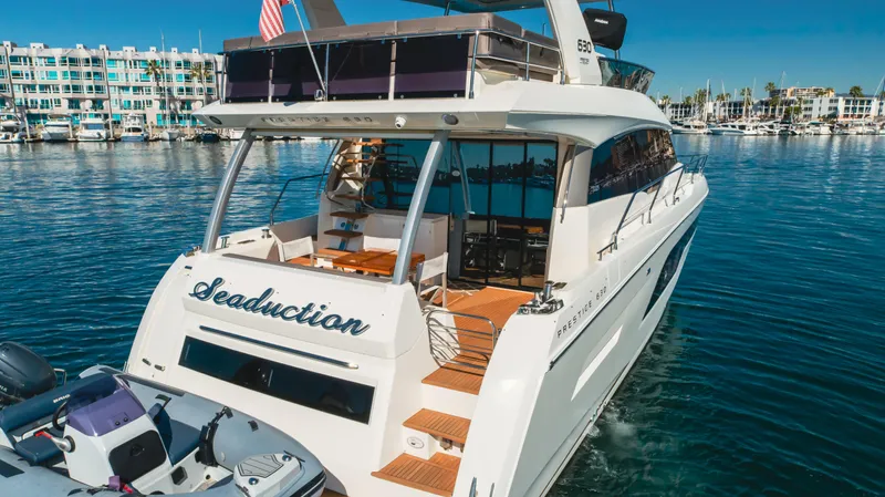Seaduction Yacht Photos Pics Luxurious 2018 Prestige 630 yacht named "Seaduction" cruising in a marina.