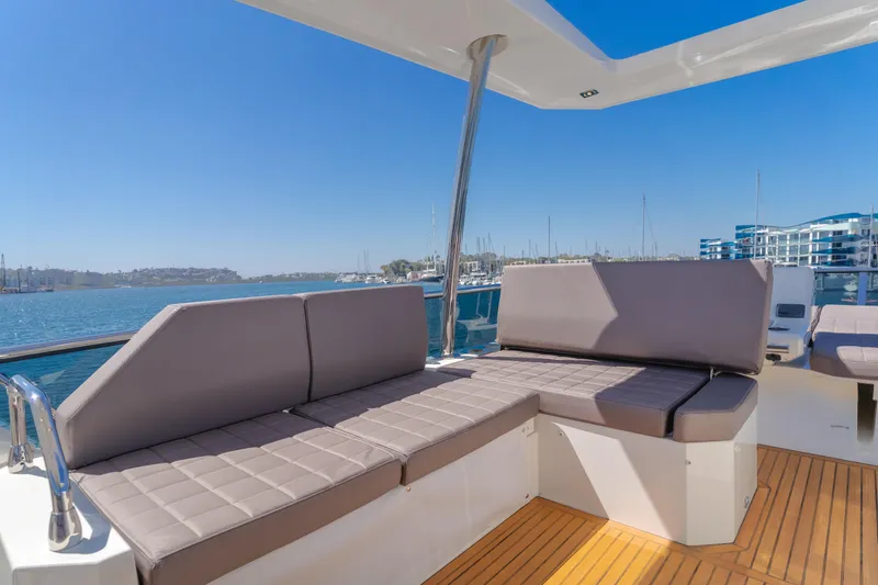 Seaduction Yacht Photos Pics Luxurious seating on 2018 Prestige 630 yacht with scenic marina view.
