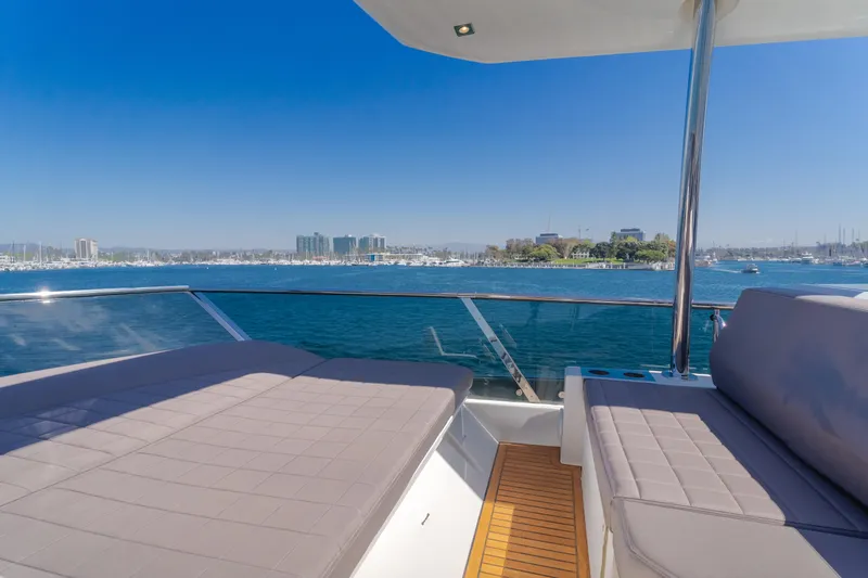 Seaduction Yacht Photos Pics Luxurious 2018 Prestige 630 yacht deck with ocean view and city skyline.