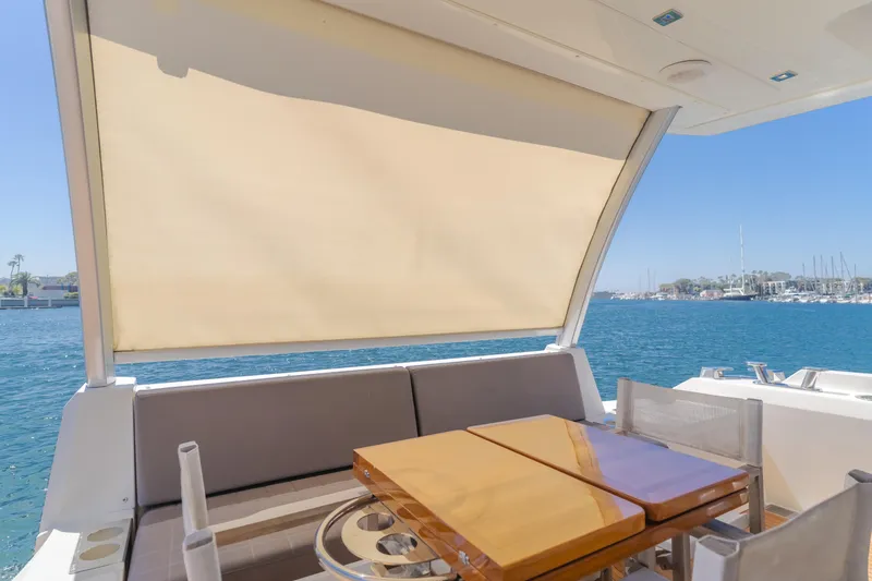 Seaduction Yacht Photos Pics Prestige 630 yacht 2018, outdoor seating area with table, ocean view.