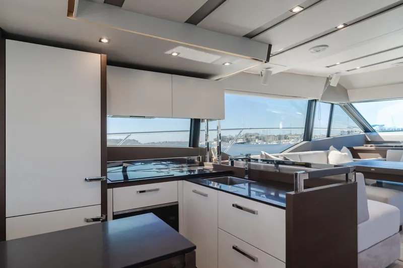 Seaduction Yacht Photos Pics Luxurious interior of 2018 Prestige 630 yacht with modern kitchen and panoramic windows.