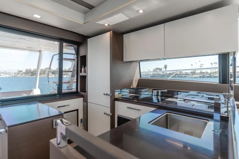 Seaduction Yacht Photos Pics Luxurious kitchen interior of 2018 Prestige 630 yacht with modern appliances and ocean view.