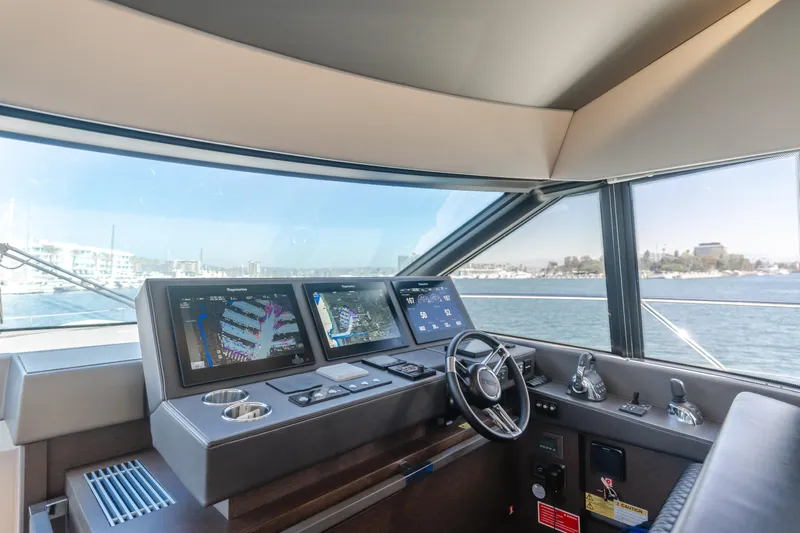 Seaduction Yacht Photos Pics Prestige 630 yacht helm, 2018 model, featuring advanced navigation systems and panoramic sea view.
