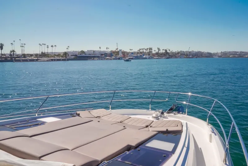 Seaduction Yacht Photos Pics Prestige 630 yacht on calm waters, sunny day, coastal view, 2018 model.