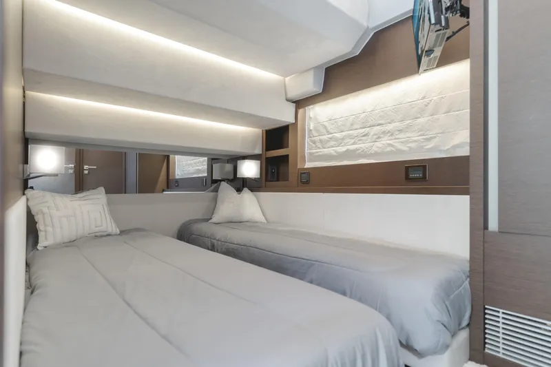 Seaduction Yacht Photos Pics Luxurious twin cabin interior of 2018 Prestige 630 yacht with modern lighting and decor.