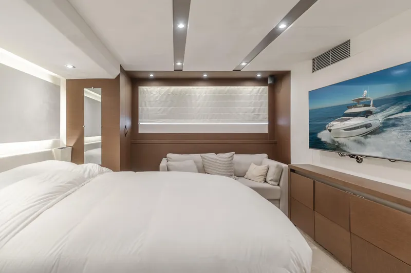 Seaduction Yacht Photos Pics Luxurious bedroom interior on 2018 Prestige 630 yacht with modern decor and cozy seating.