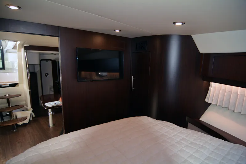  Yacht Photos Pics Luxurious interior of 2018 Regal 46 Sport Coupe with modern furnishings and ambient lighting.