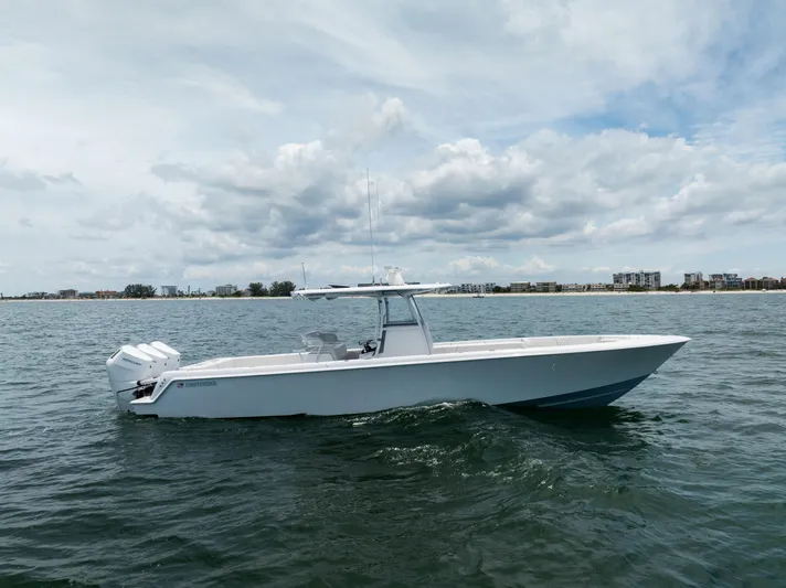  Yacht Photos Pics 2024 Contender 39 ST boat on open water under cloudy sky.