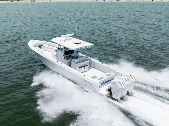  Yacht Photos Pics 2024 Contender 39 ST boat cruising on open water, showcasing powerful engines.