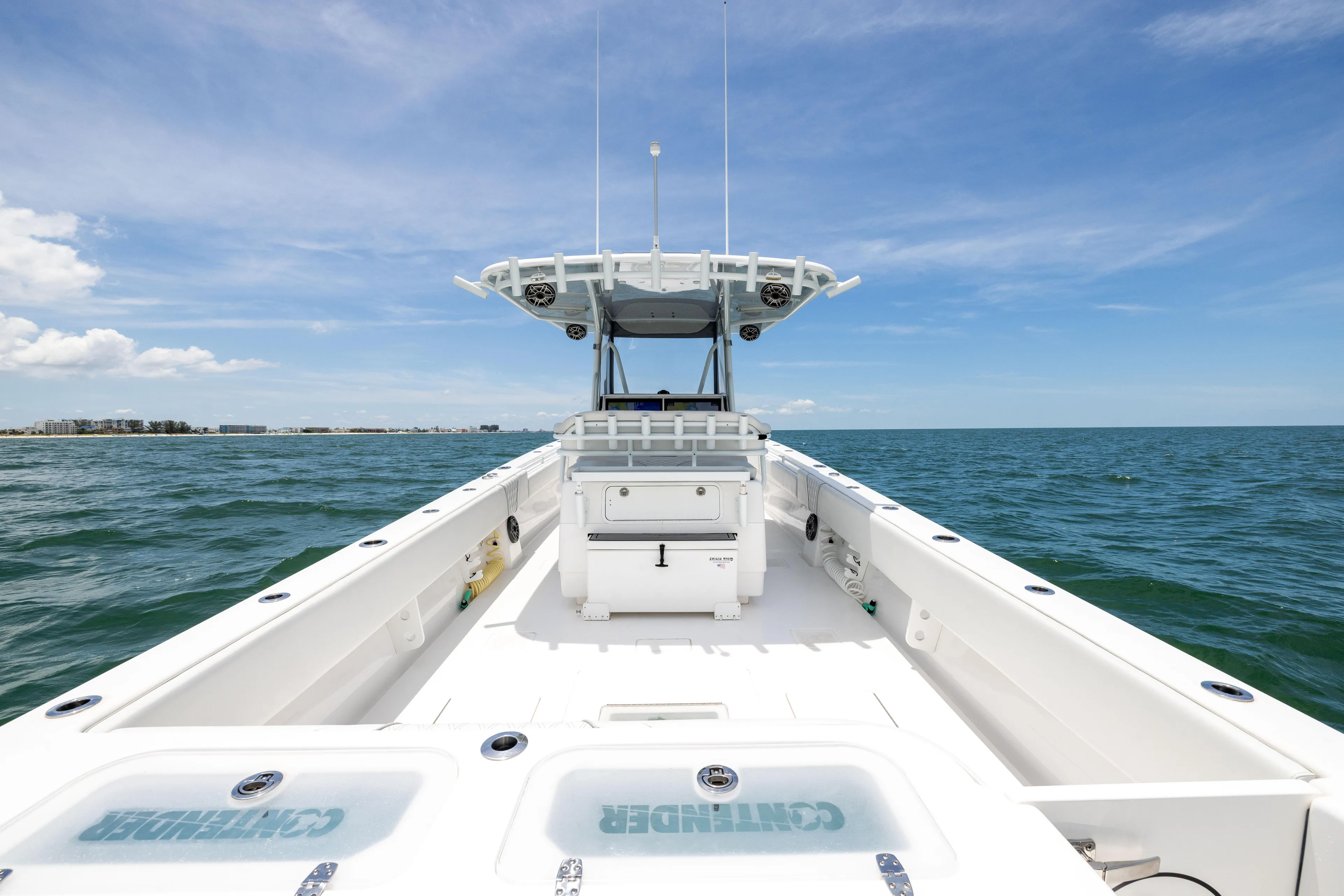  Yacht Photos Pics 2024 Contender 39 ST boat on open water under clear blue sky.