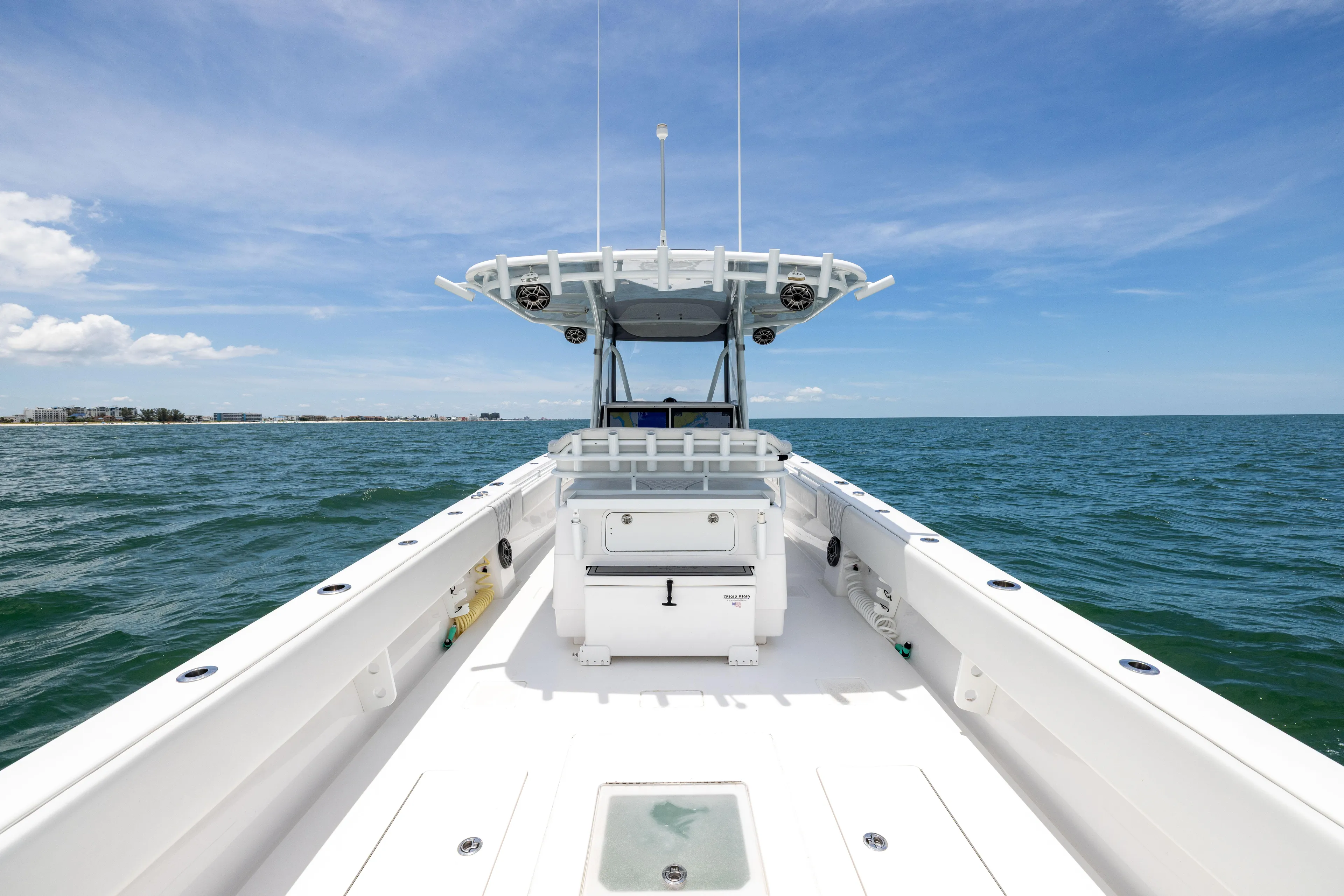  Yacht Photos Pics 2024 Contender 39 ST boat on open water under clear blue sky.