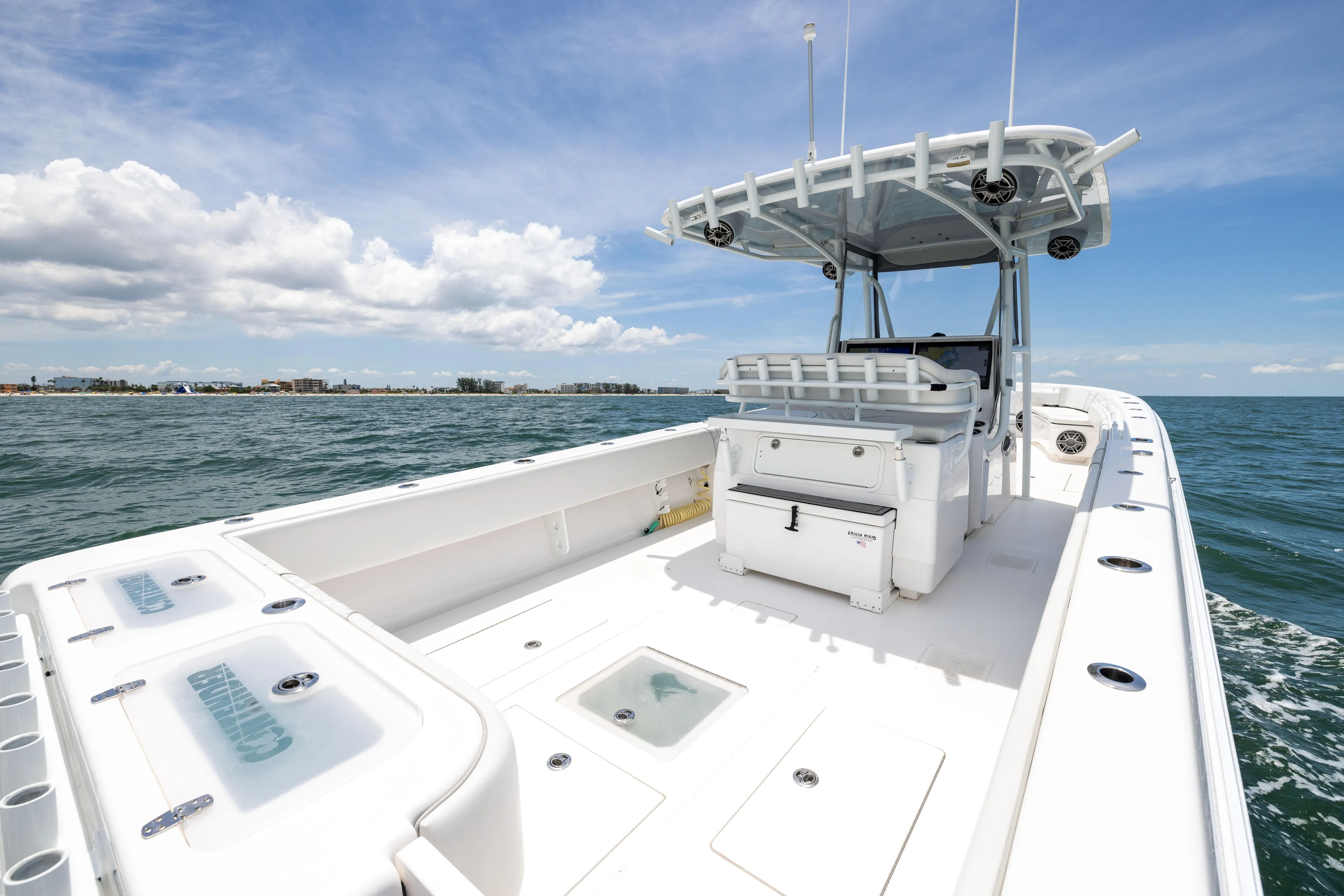  Yacht Photos Pics 2024 Contender 39 ST boat on open water, featuring spacious deck and modern design.