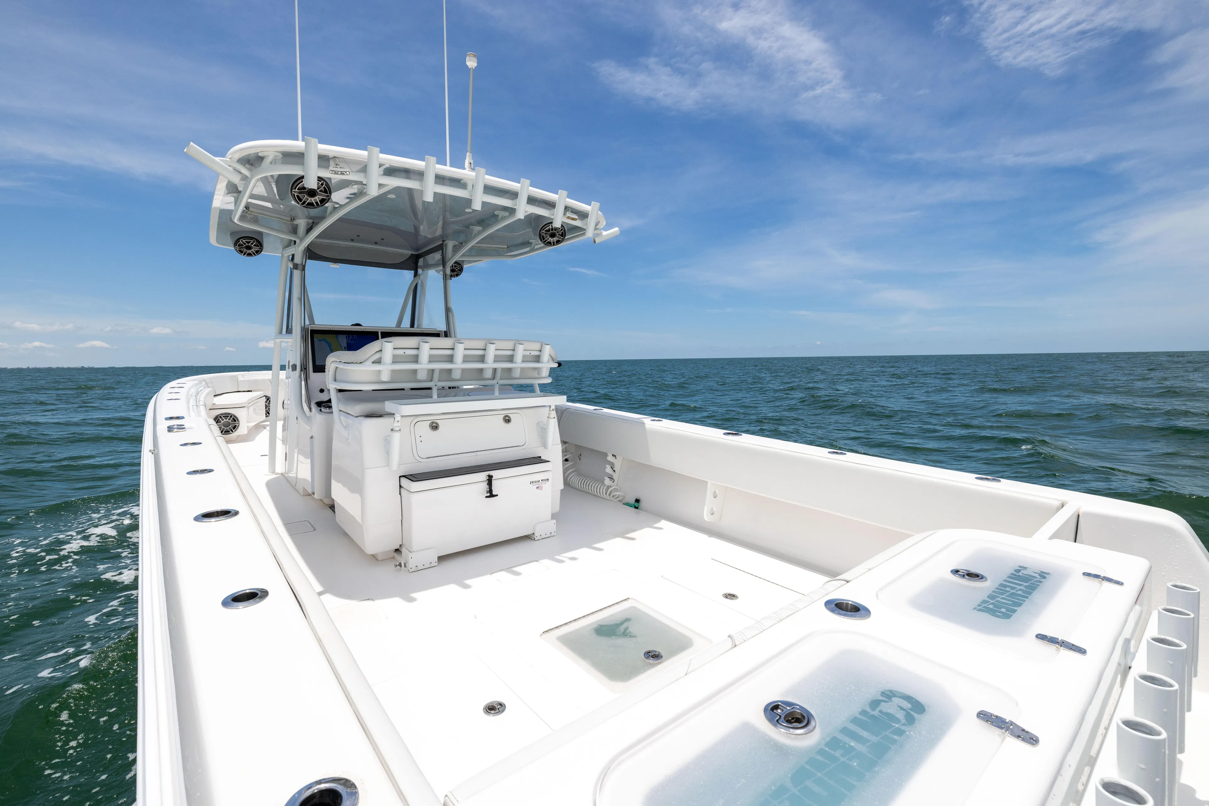 Yacht Photos Pics 2024 Contender 39 ST boat on open sea under clear blue sky.