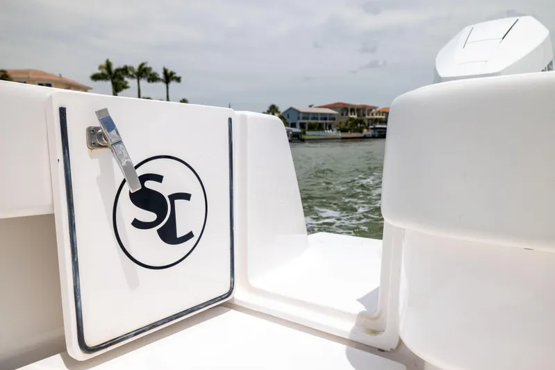  Yacht Photos Pics 2024 Contender 39 ST boat detail with logo, dockside view.