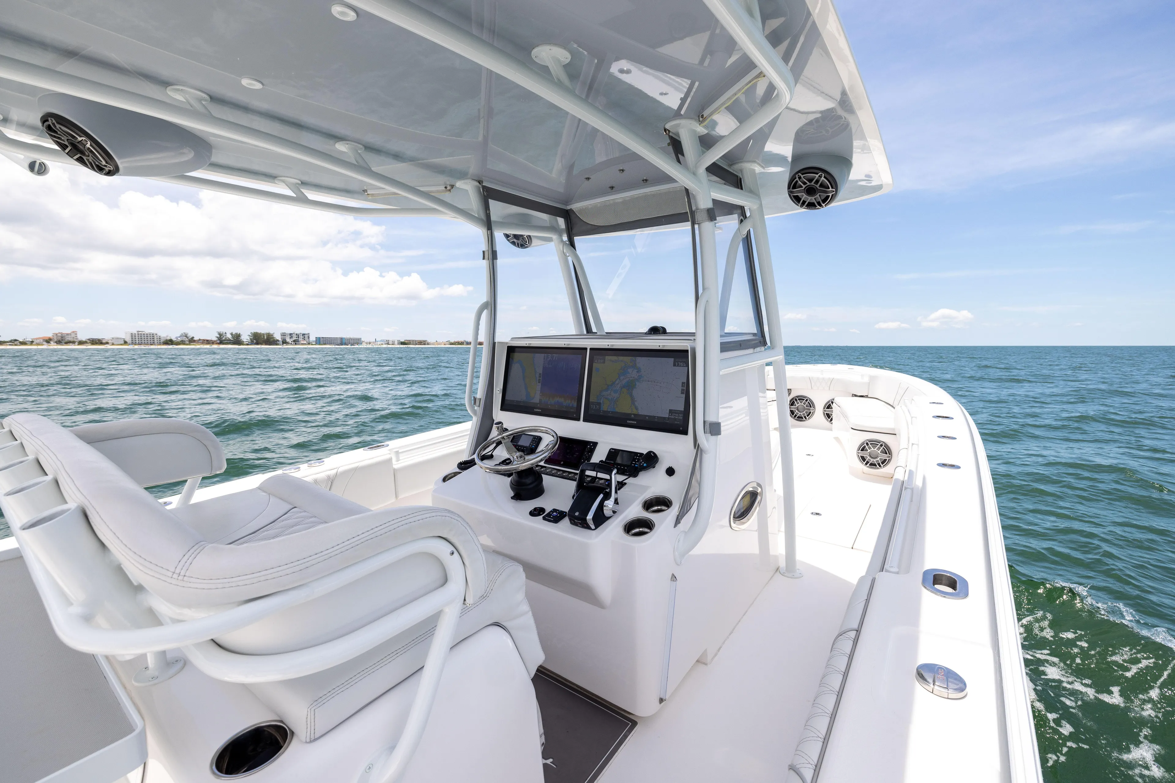  Yacht Photos Pics 2024 Contender 39 ST boat interior with advanced navigation system on open sea.