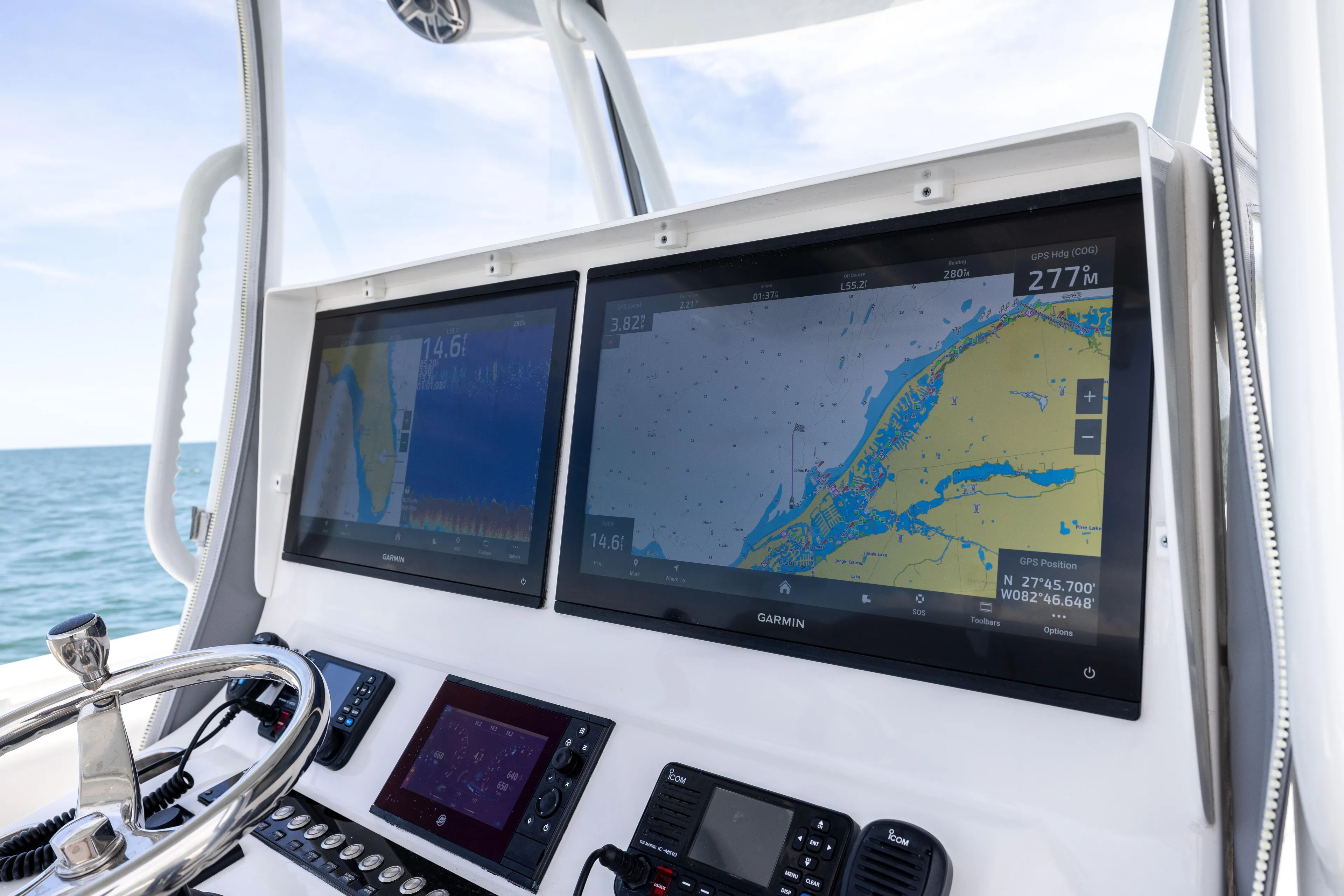  Yacht Photos Pics 2024 Contender 39 ST boat dashboard with dual Garmin navigation screens.