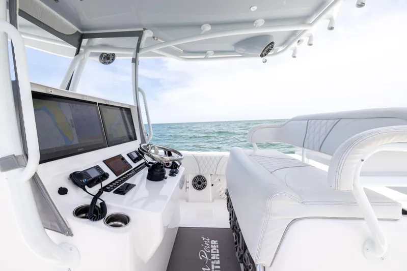 Yacht Photos Pics 2024 Contender 39 ST boat cockpit with advanced navigation systems and luxurious seating.
