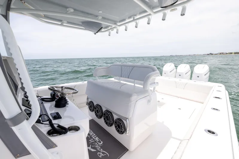  Yacht Photos Pics 2024 Contender 39 ST boat interior with helm, seating, and ocean view.