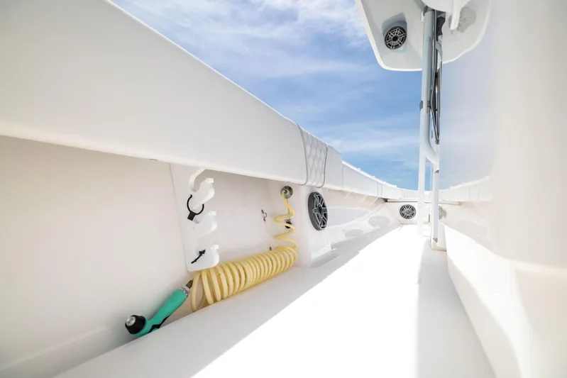  Yacht Photos Pics 2024 Contender 39 ST boat interior with hose and speakers under clear sky.