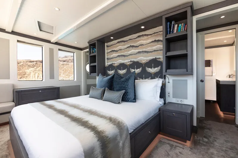 Far Niente Yacht Photos Pics Luxurious bedroom in 2024 Hoek Design Motor Yacht, featuring elegant decor and modern amenities.
