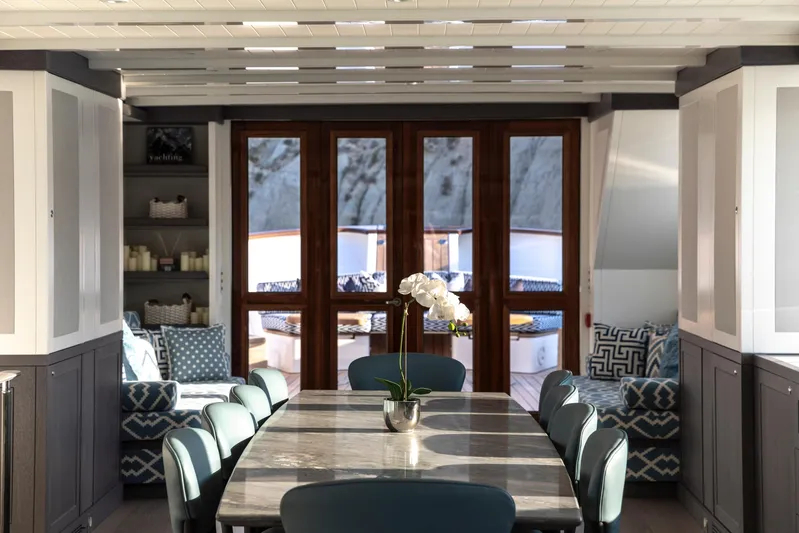 Far Niente Yacht Photos Pics Luxurious interior of 2024 Hoek Design Motor Yacht, featuring elegant dining area and modern decor.