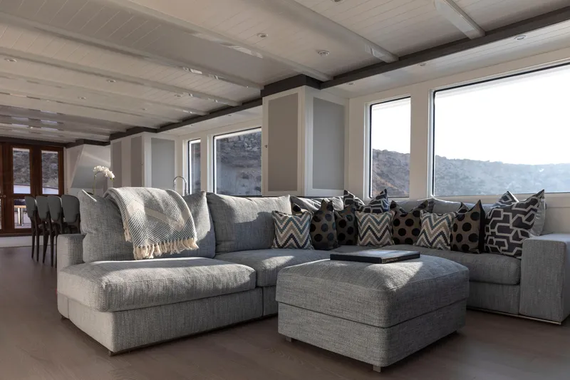 Far Niente Yacht Photos Pics Luxurious interior of 2024 Hoek Design Motor Yacht, featuring modern classic decor and panoramic windows.