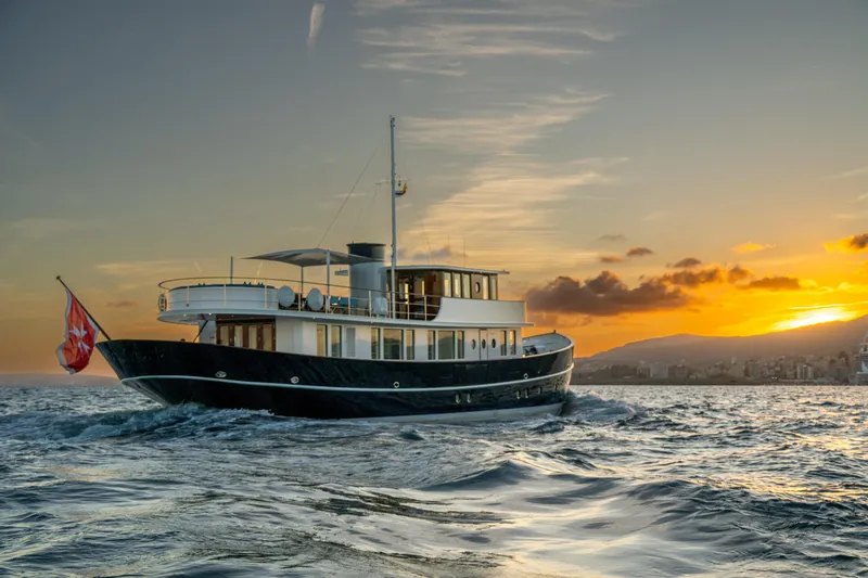 Far Niente Yacht Photos Pics 2024 Ses Yachts Hoek Design Modern Classic sailing at sunset.