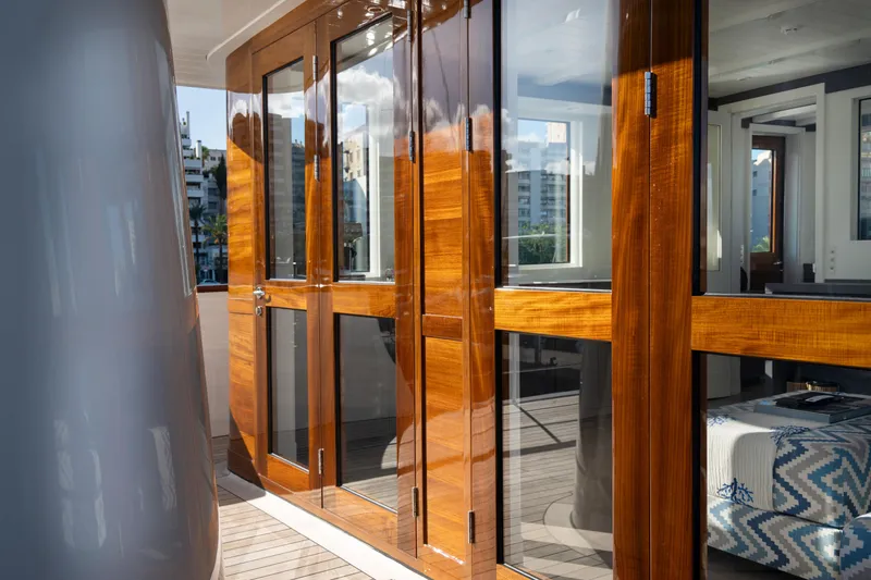 Far Niente Yacht Photos Pics Luxurious wooden doors on 2024 Ses Yachts Hoek Design Modern Classic yacht deck.