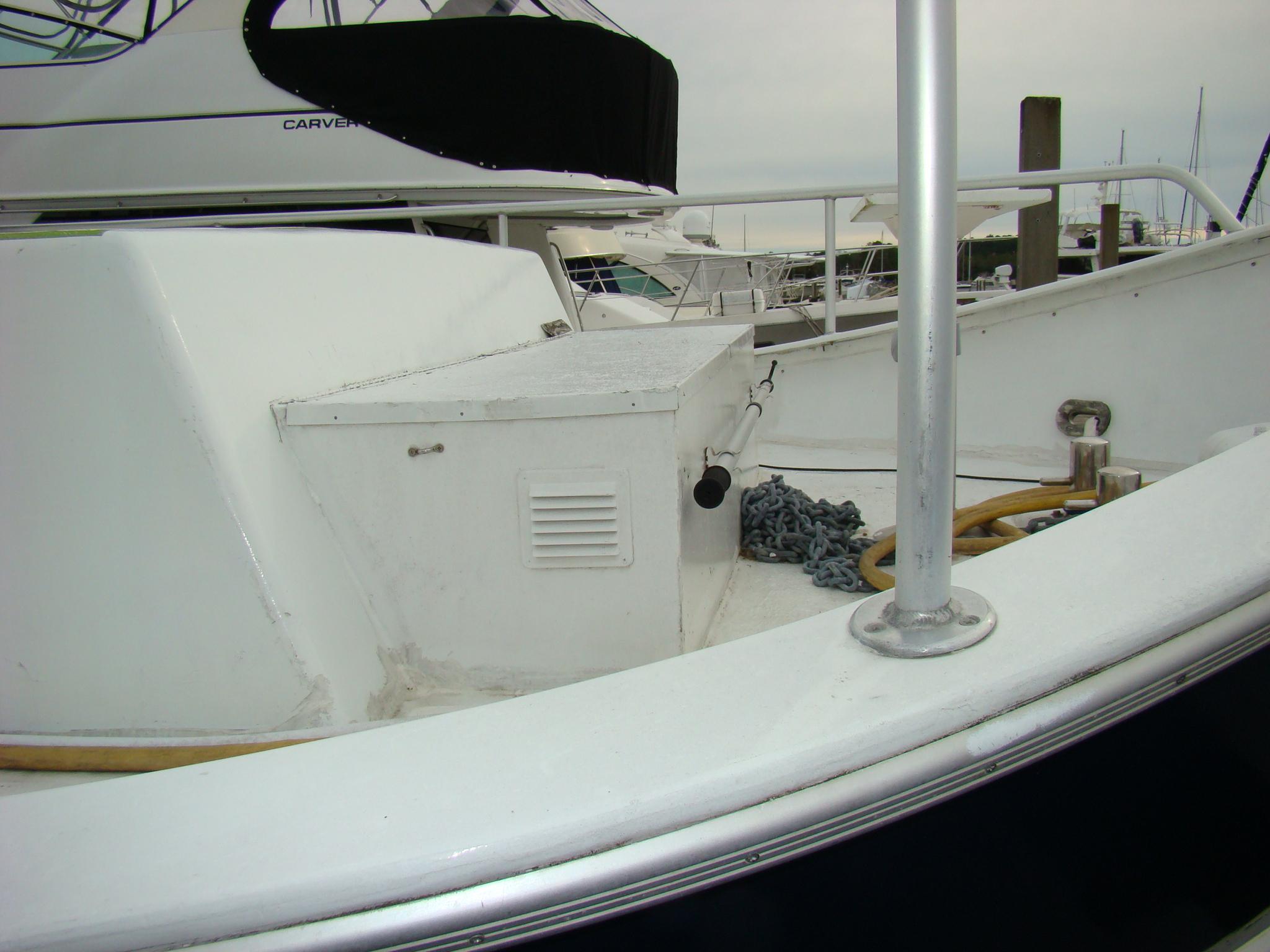 1991 Custom Trawler deck with storage box and anchor chain.