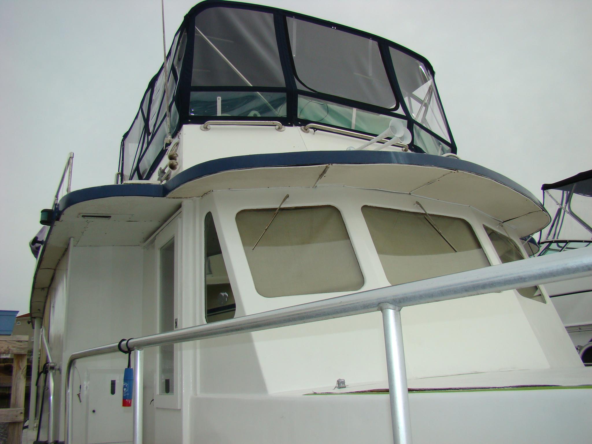 Custom 1991 Trawler with enclosed flybridge and spacious deck.