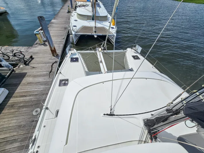 Le Tigre Yacht Photos Pics 2019 Lagoon 42 catamaran docked at marina, viewed from above.