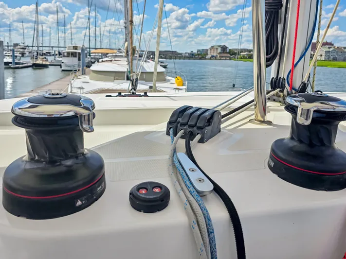 Le Tigre Yacht Photos Pics Sailing equipment on a 2019 Lagoon 42 catamaran docked at a marina.