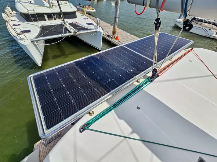 Le Tigre Yacht Photos Pics 2019 Lagoon 42 catamaran with solar panels docked at marina.