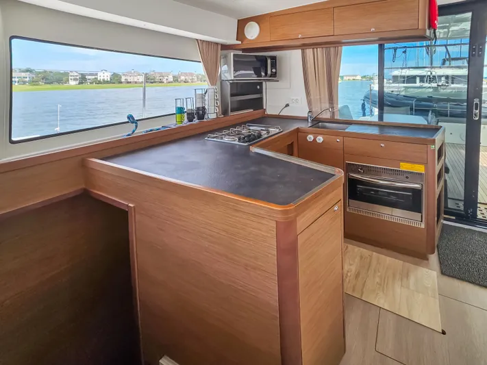 Le Tigre Yacht Photos Pics Interior of 2019 Lagoon 42 yacht kitchen with modern appliances and waterfront view.