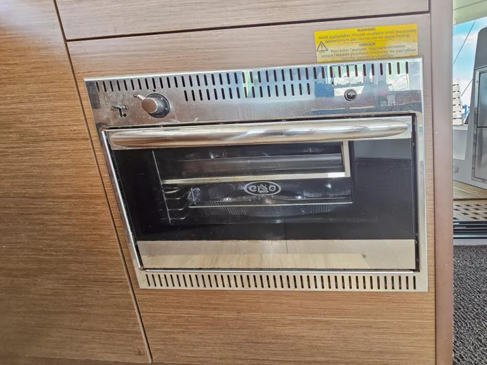 Le Tigre Yacht Photos Pics Built-in oven on a 2019 Lagoon 42 yacht, featuring a sleek stainless steel design.