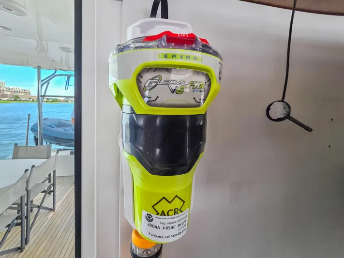 Le Tigre Yacht Photos Pics EPIRB device on 2019 Lagoon 42 catamaran, docked with water view.