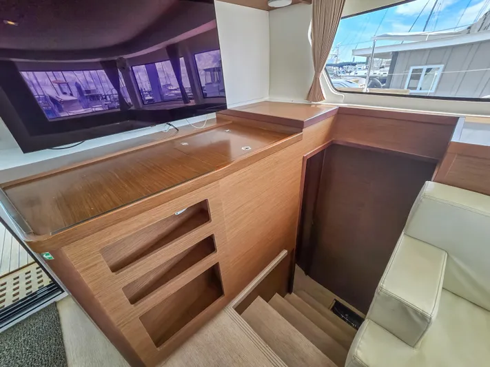 Le Tigre Yacht Photos Pics Interior of 2019 Lagoon 42 yacht with wooden cabinetry and staircase.