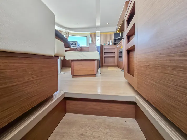 Le Tigre Yacht Photos Pics Interior of 2019 Lagoon 42 yacht, featuring modern wood finishes and comfortable seating.